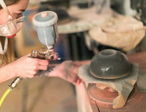 spraying underglaze on pottery